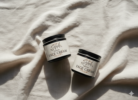 Two jars of face cream on a textured fabric background