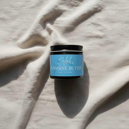 Jar of 'Sunshine Butter' on a textured surface